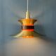 Large UFO flying saucer pendant light with orange light.