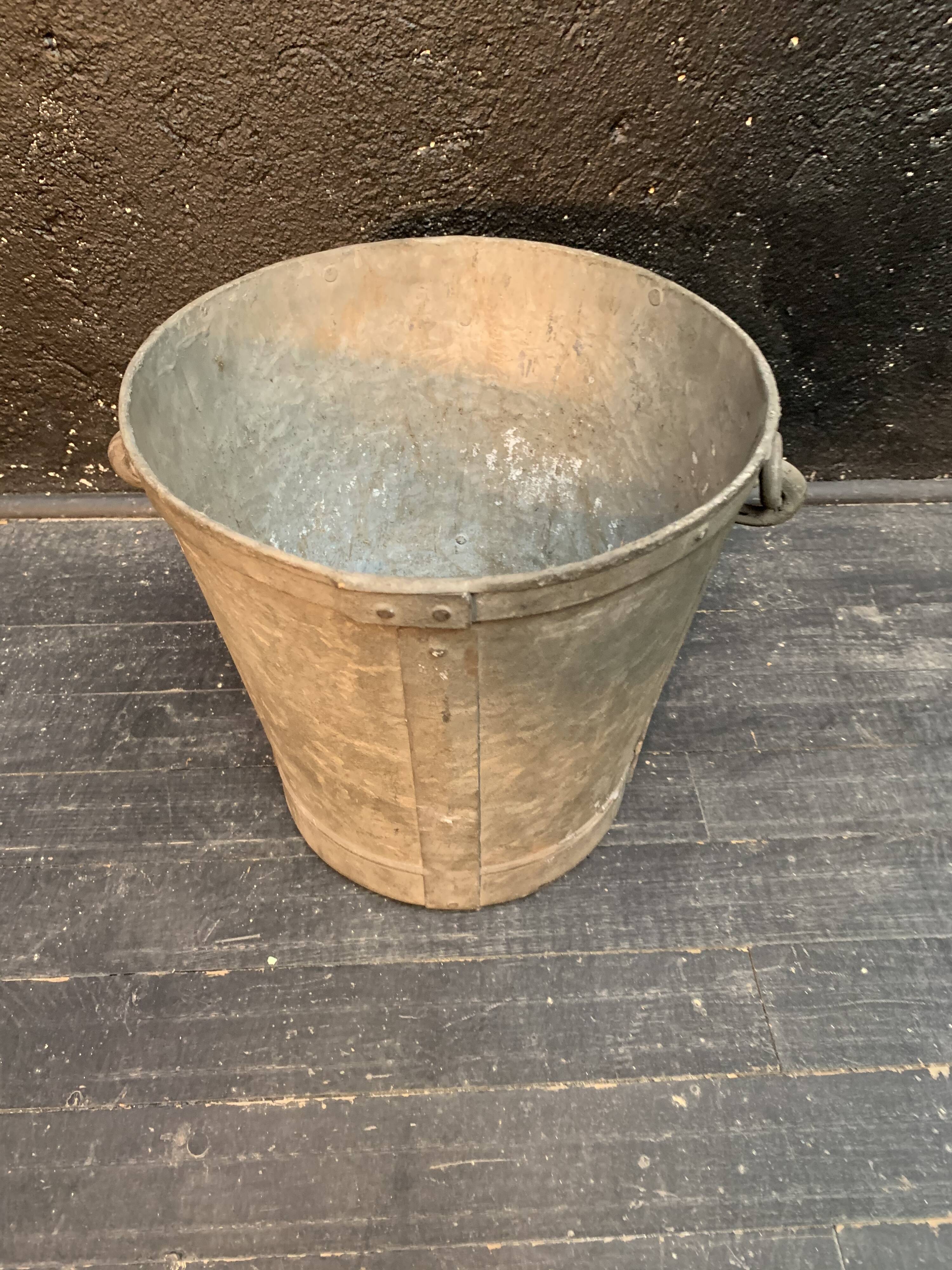 Ancient metal garden bucket