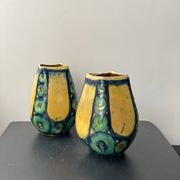 A pair of green and yellow vases