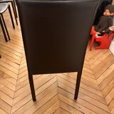 Many brown leather chairs "Roche Bobois"