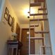 Two screens, partition walls, curved beech wood shelves.