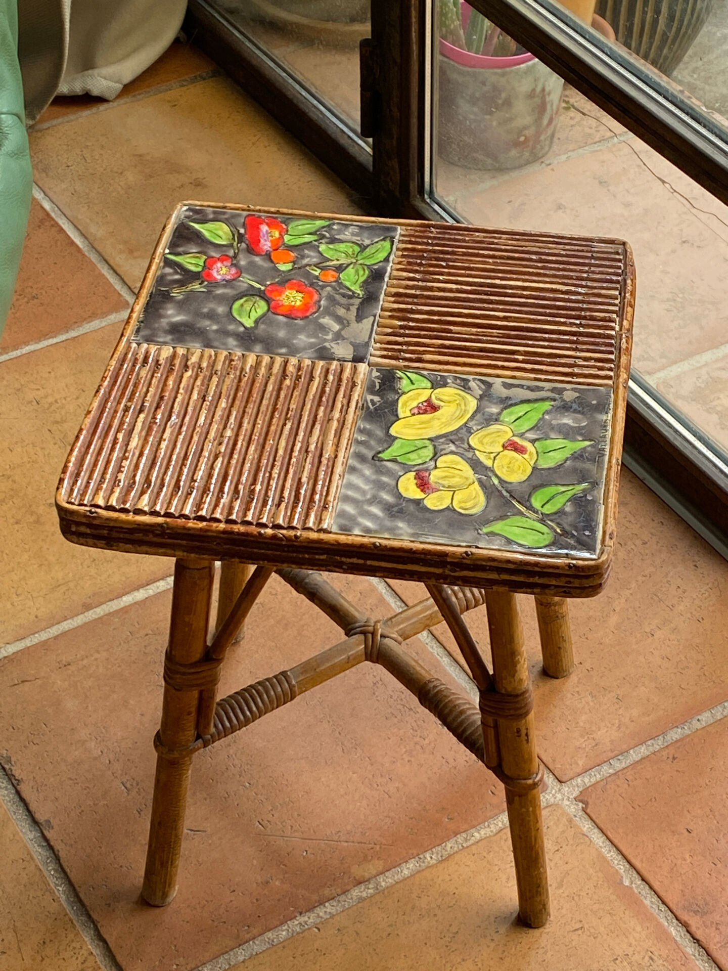 Rattan and ceramic coffee table attributed to Audoux and Minnet.