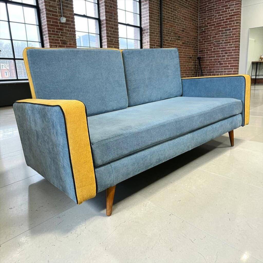 Vintage blue armchair/daybed/sofa bed with yellow accents.