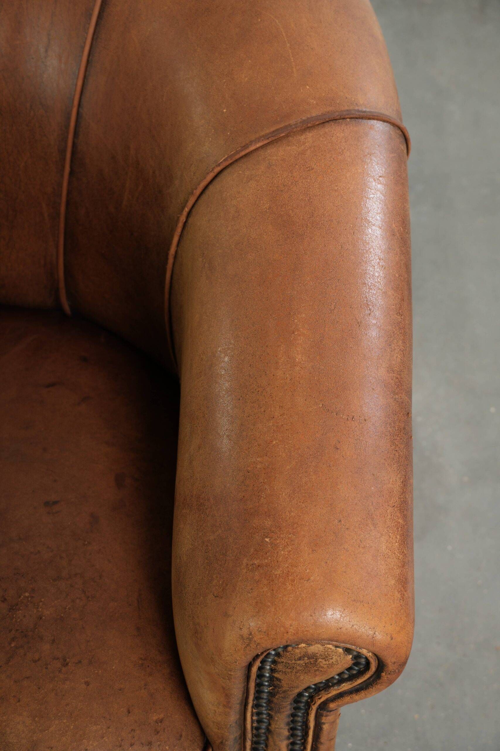 Sturdy set of vintage sheepskin club armchairs with a great appearance