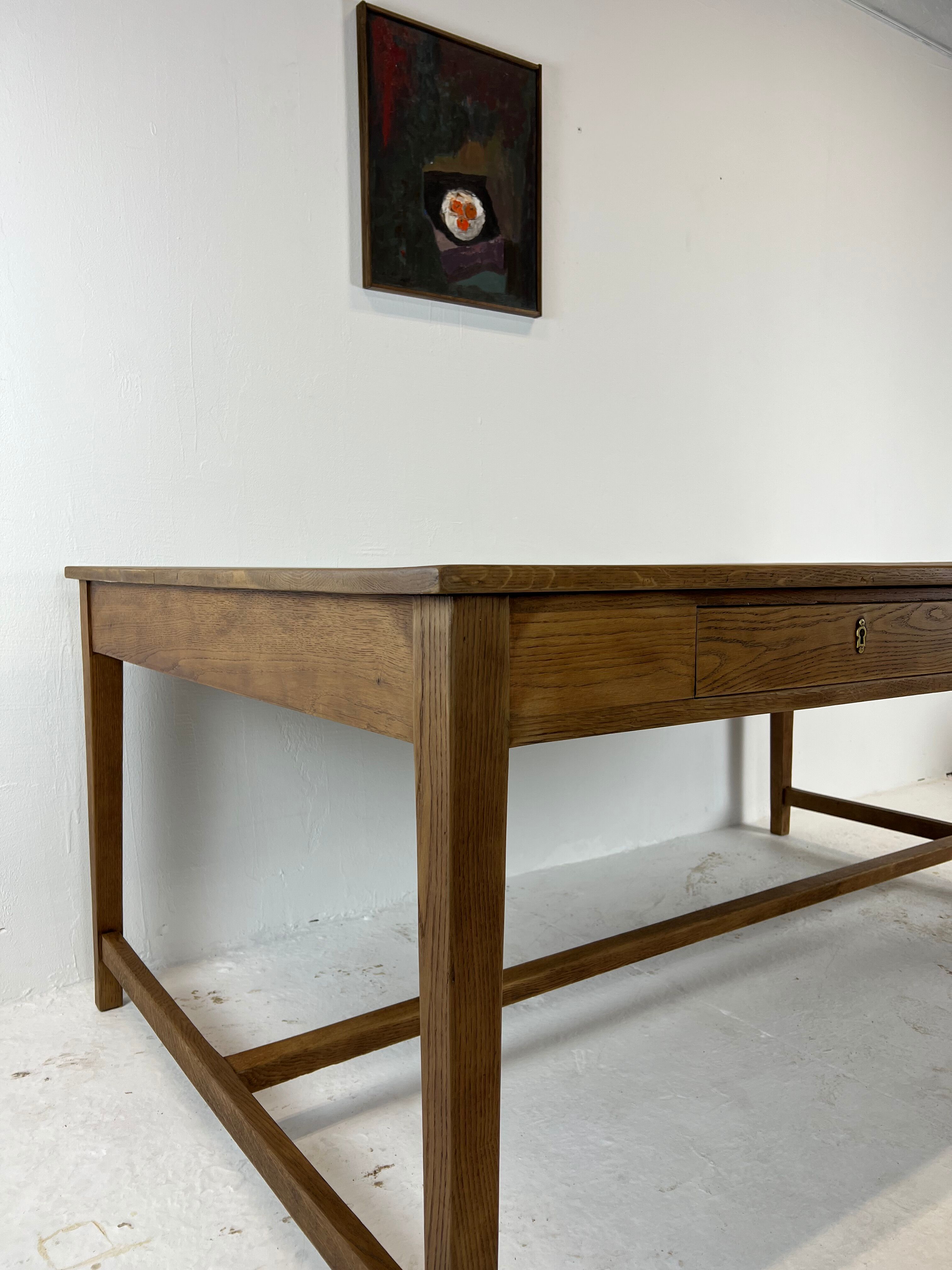 Two-sided oak work table, with 4 drawers