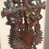 Antique wooden crucifix carved from the Black Forest with grapes and leaves.