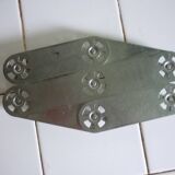 Expandable stainless steel trivet from the 50s and 60s