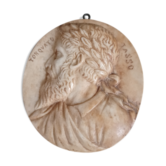 Old medallion in carved marble torquato tasso