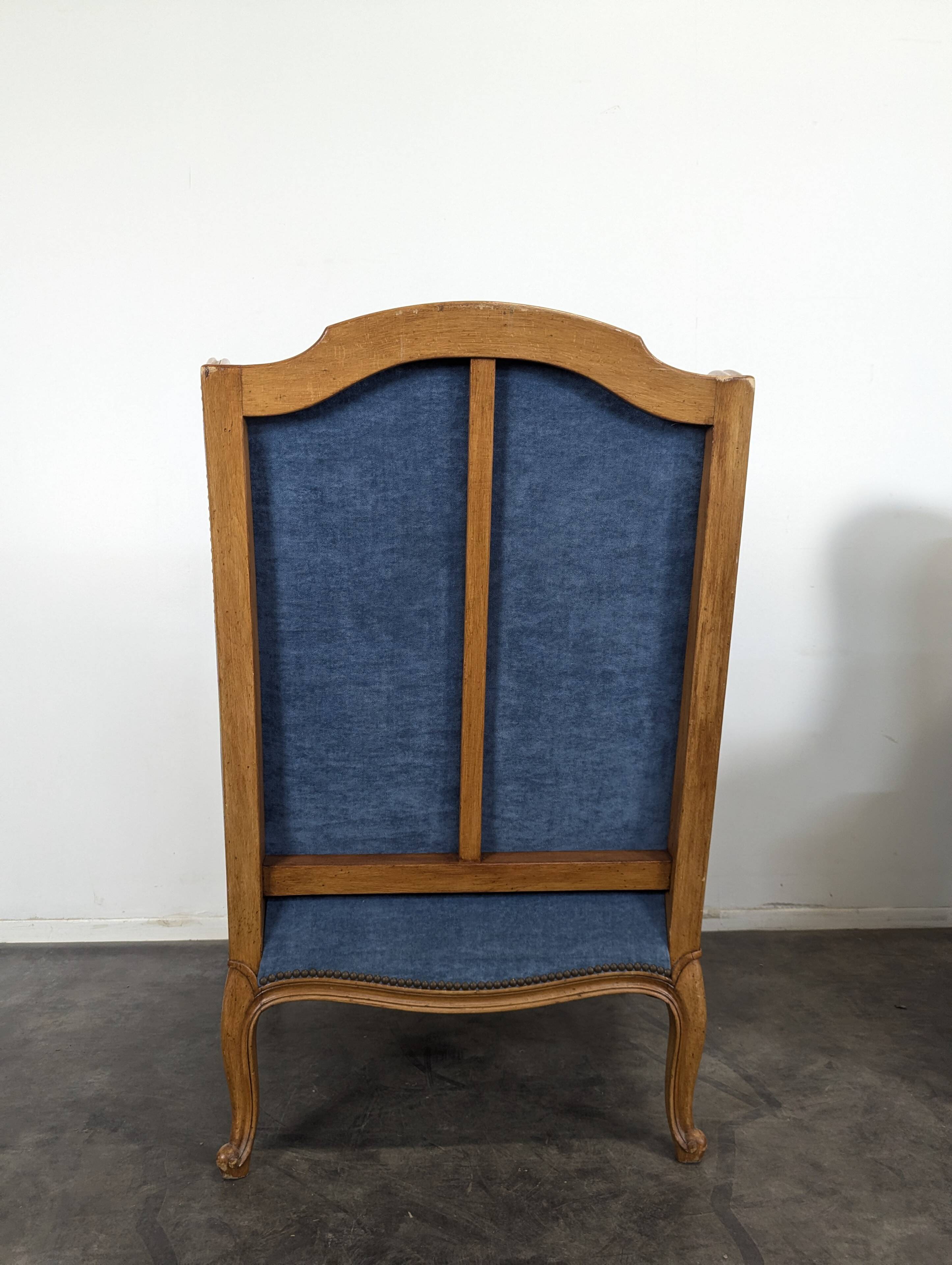 Pair of Louis XV style wingback armchairs in blue velvet.