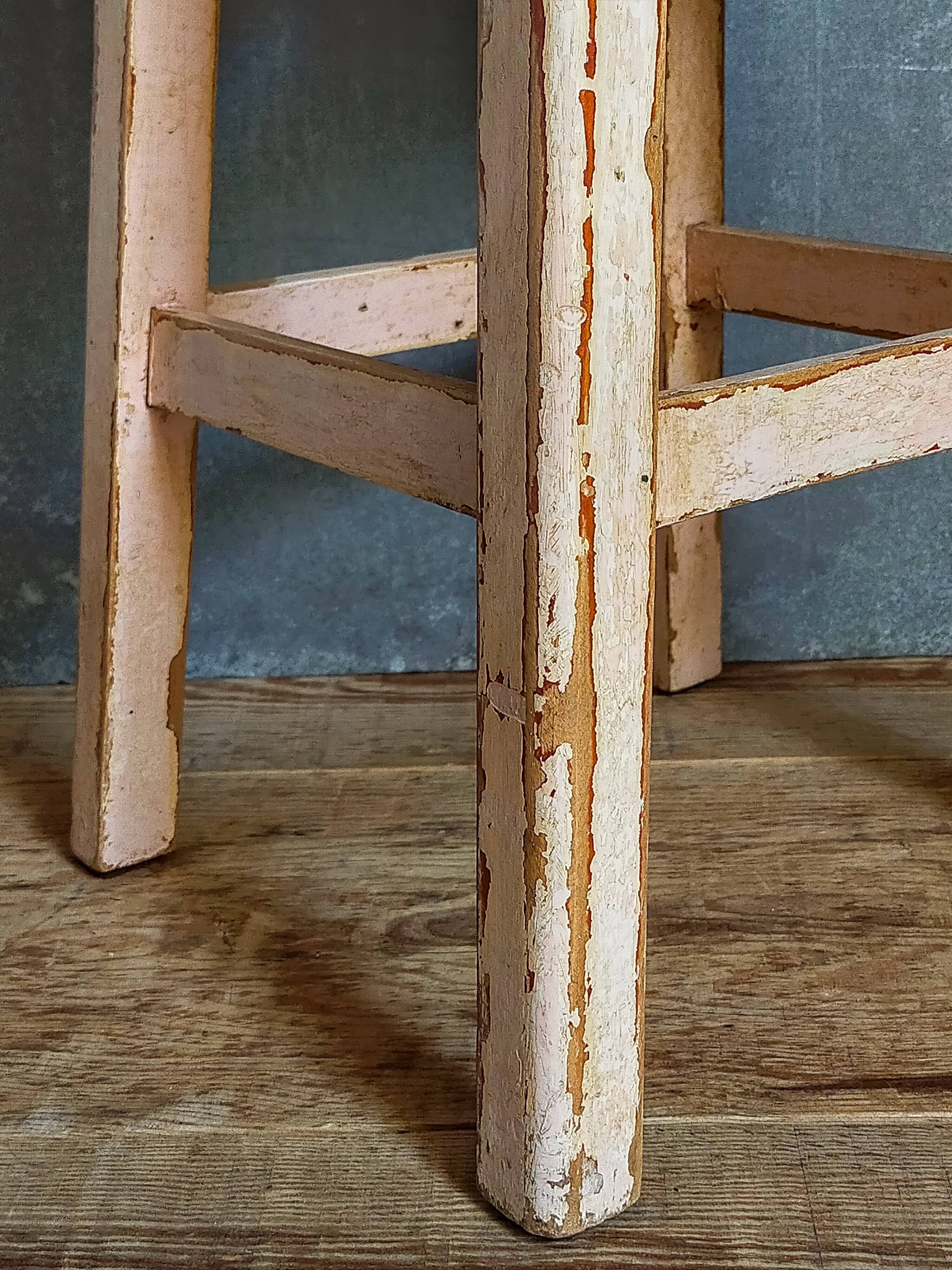 Antique workshop stool in patinated solid wood