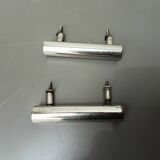 Two chrome drawer handles