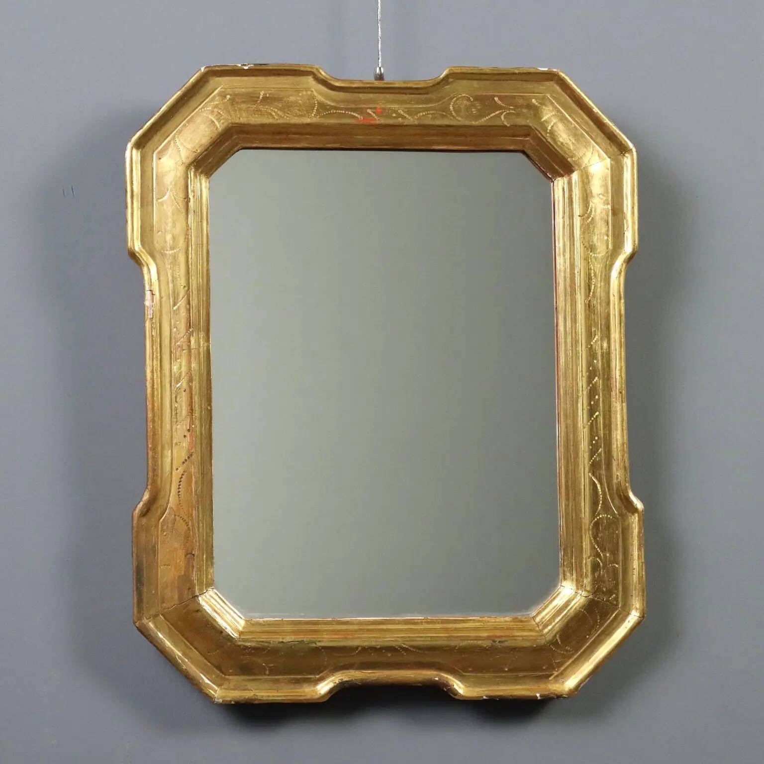 Antique cabaret mirror in gilded wood, Italy, mid-19th century.