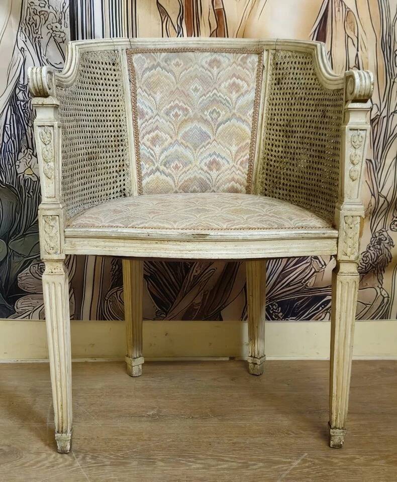 Gondola armchair in Louis XVI style, carved wood with a cream patina.