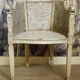 Gondola armchair in Louis XVI style, carved wood with a cream patina.