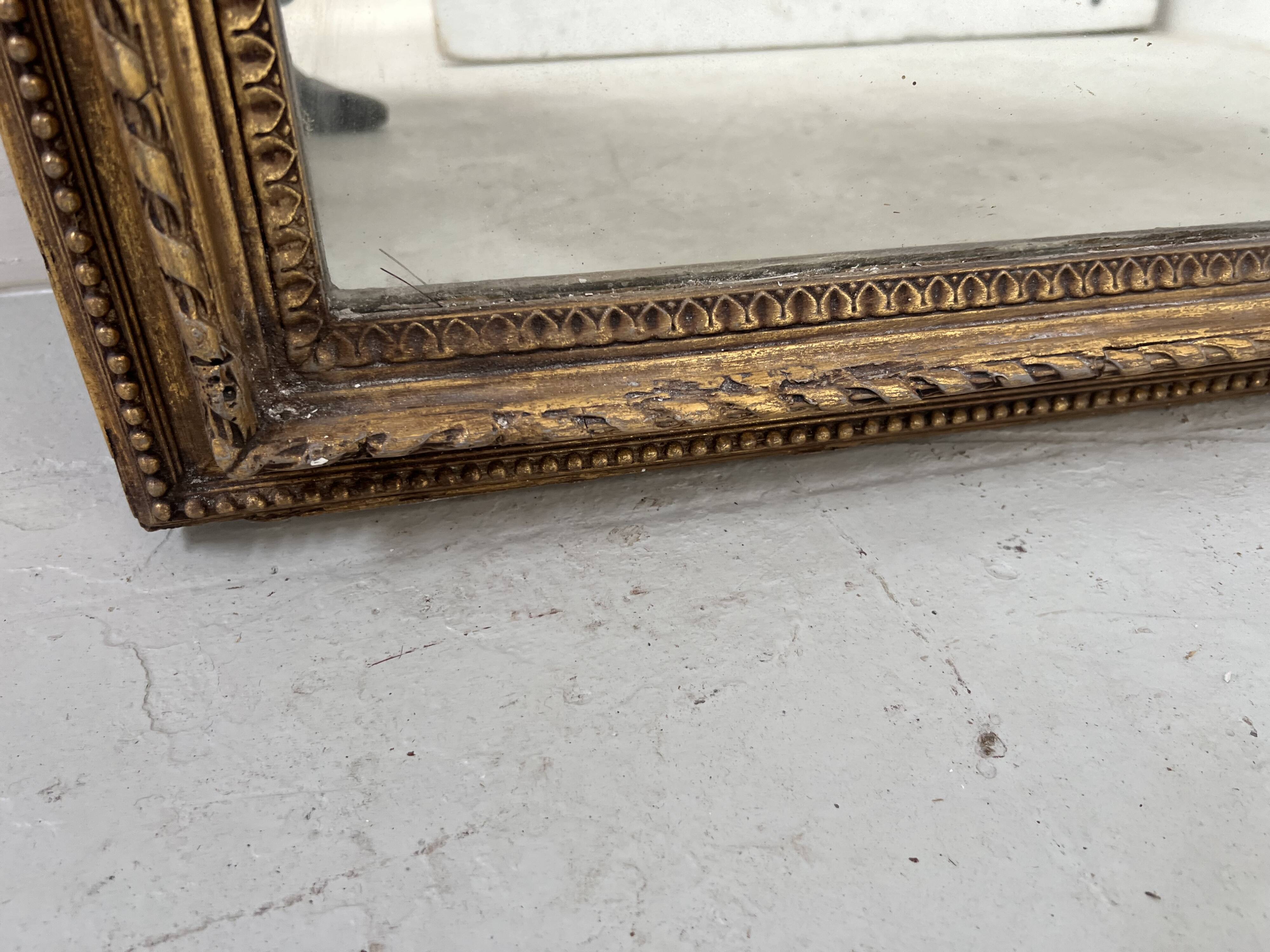 Louis XVI style mirror in wood and gilded stucco, 19th century