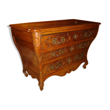 A Regency-era commode from the late 17th century, made of solid cherry wood.