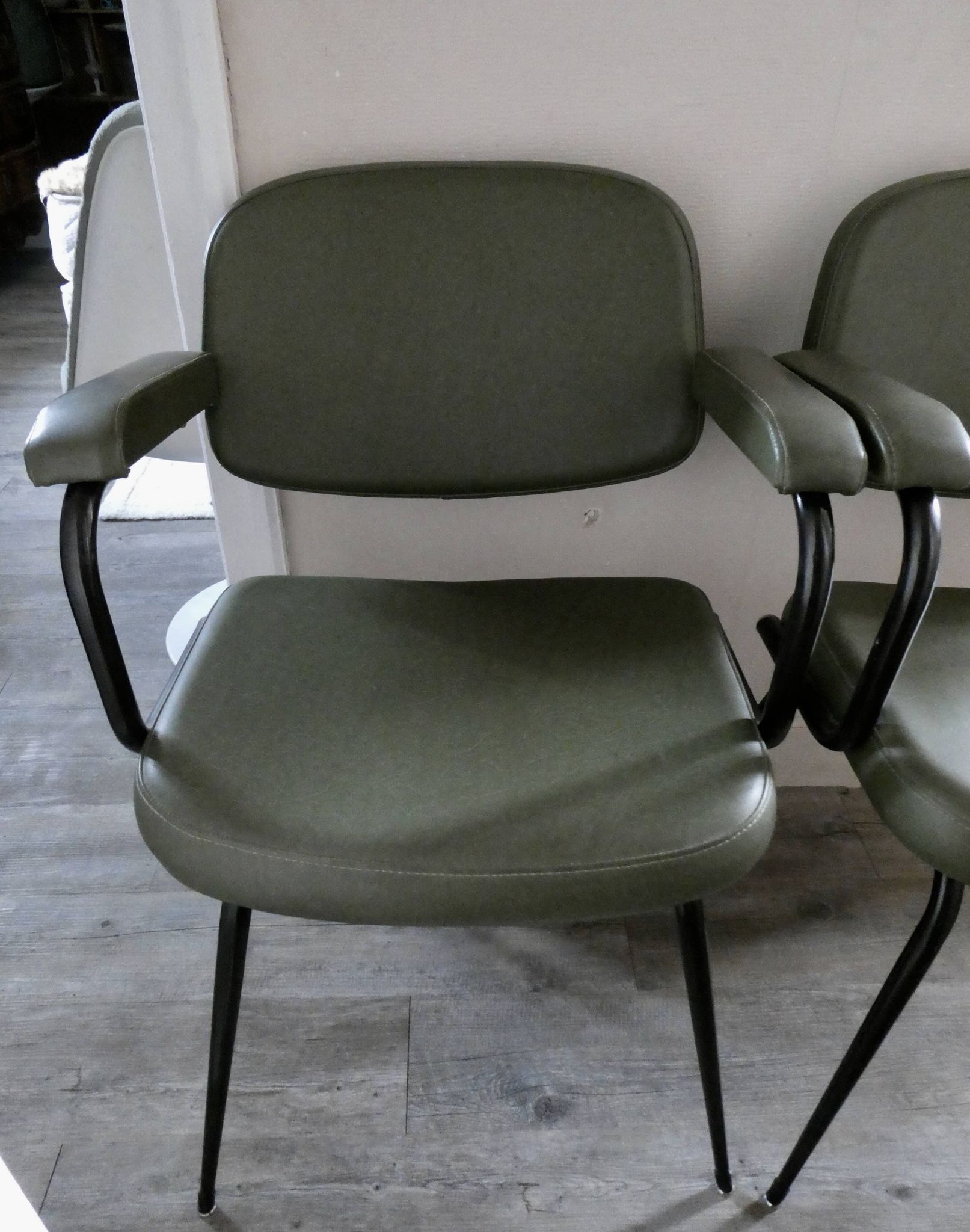 Pair of khaki green metal and skai armchairs from the 1960s
