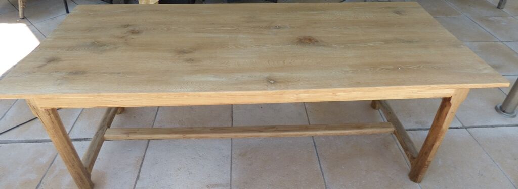 Large honey-colored farmhouse table in solid oak