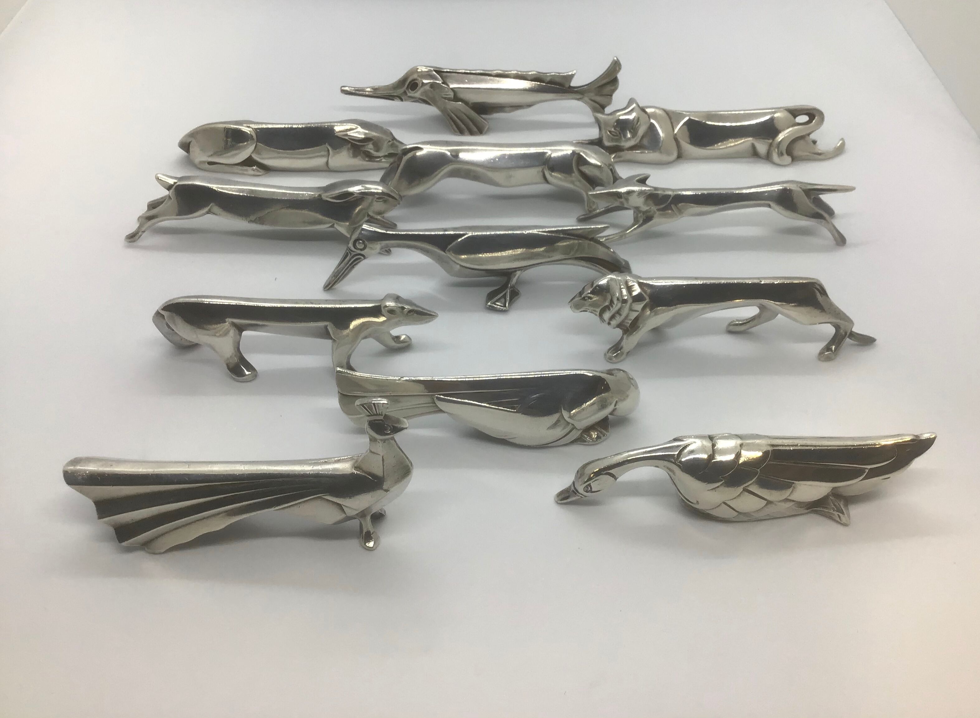 12 knife holders by Edouard Sandoz for the Goldsmith Gallia-Christofle