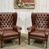 Pair of brown leather wingback Chesterfield armchairs from the 1970s.