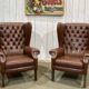 Pair of brown leather wingback Chesterfield armchairs from the 1970s.
