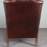 Leather armchair with decorative nails