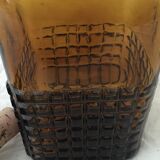 Old amber glass bottle with its wooden and cork stopper