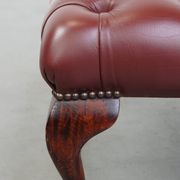 In very good condition elegant red/brown chesterfield ottoman made of cow leather