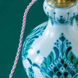 Royal Delft blue-green ceramic table lamp with pink jacquard peacock shade.