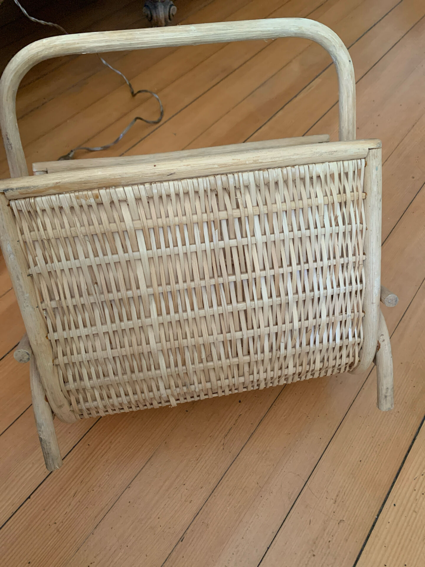 Vintage magazine rack in woven rattan and bamboo.