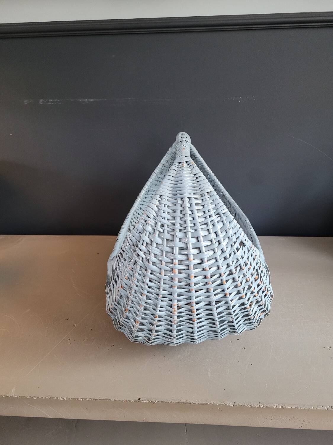 Turquoise-painted wicker basket