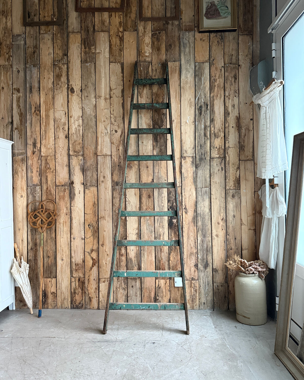 Antique ladder with green patina