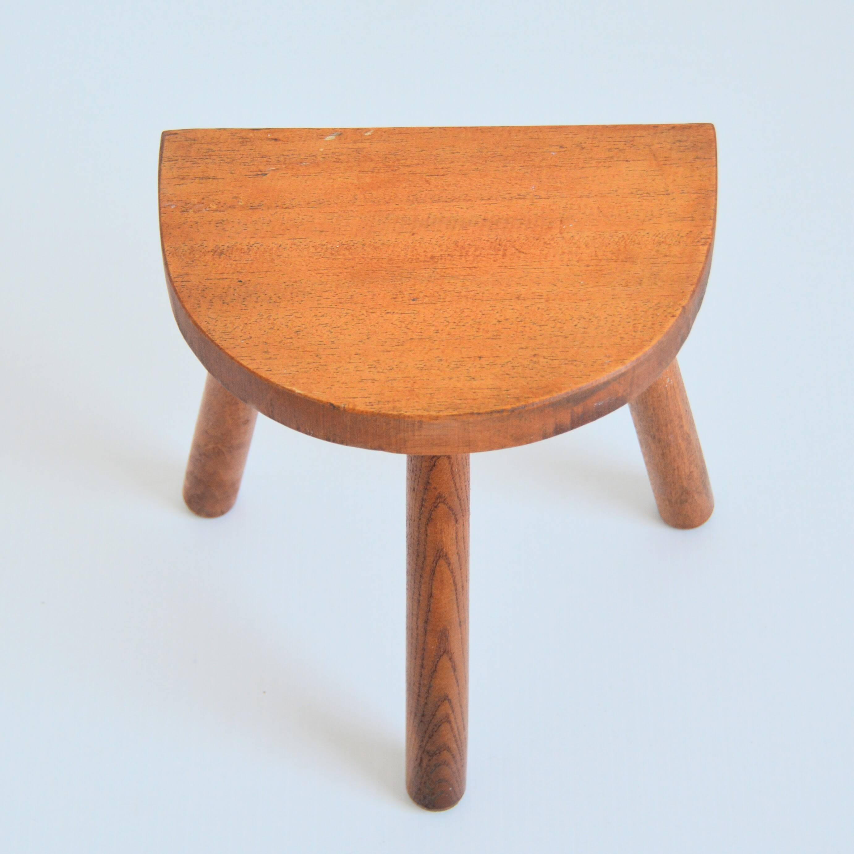 Antique brutalist wooden stool