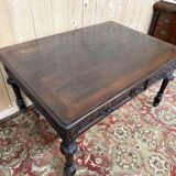 Middle table in a sculpted Louis XIII style living room.