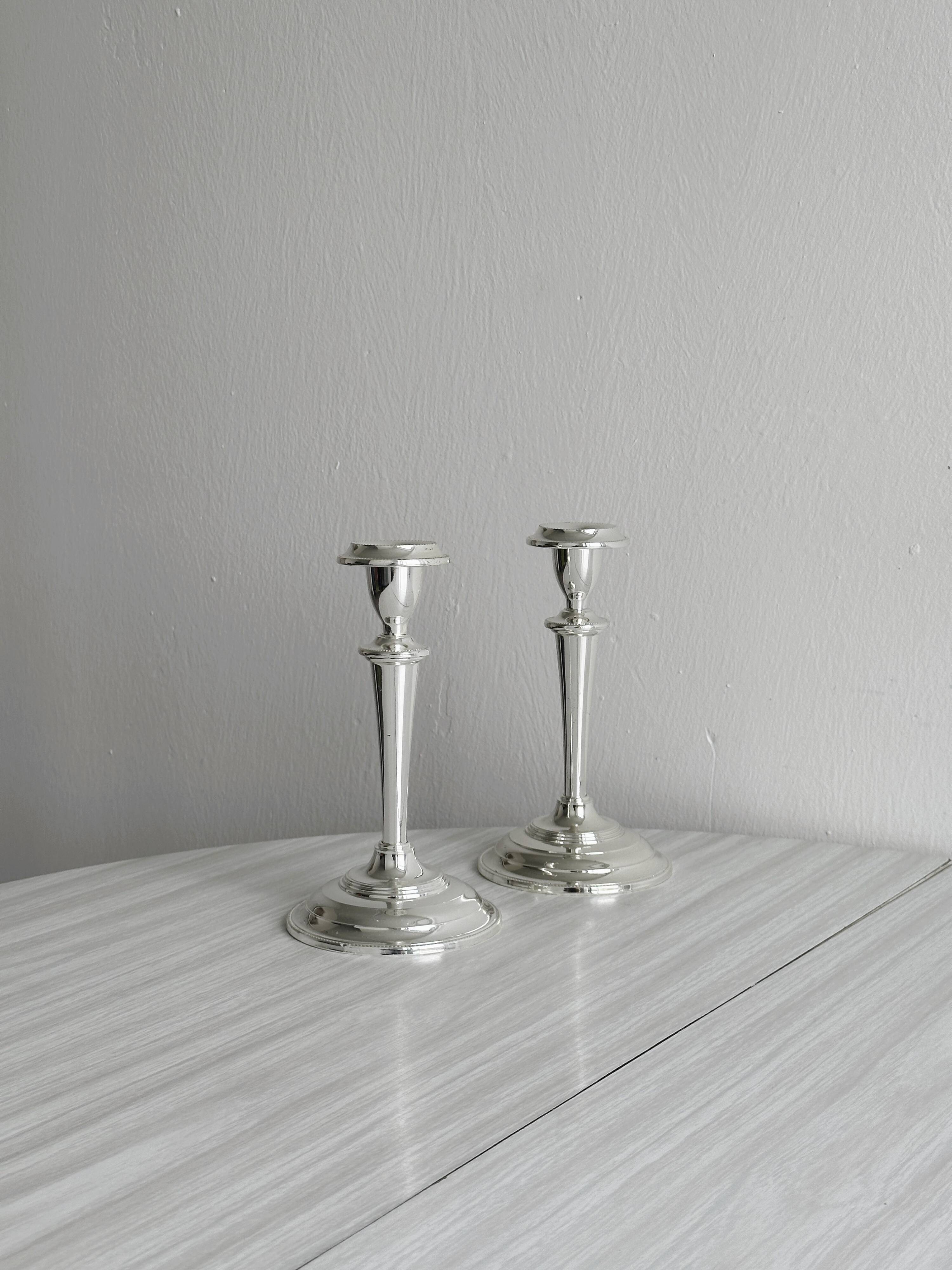 Pair of elegant stainless steel candlesticks