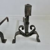 Pair of ironwork andirons in the style of Raymond Subes, circa 1940