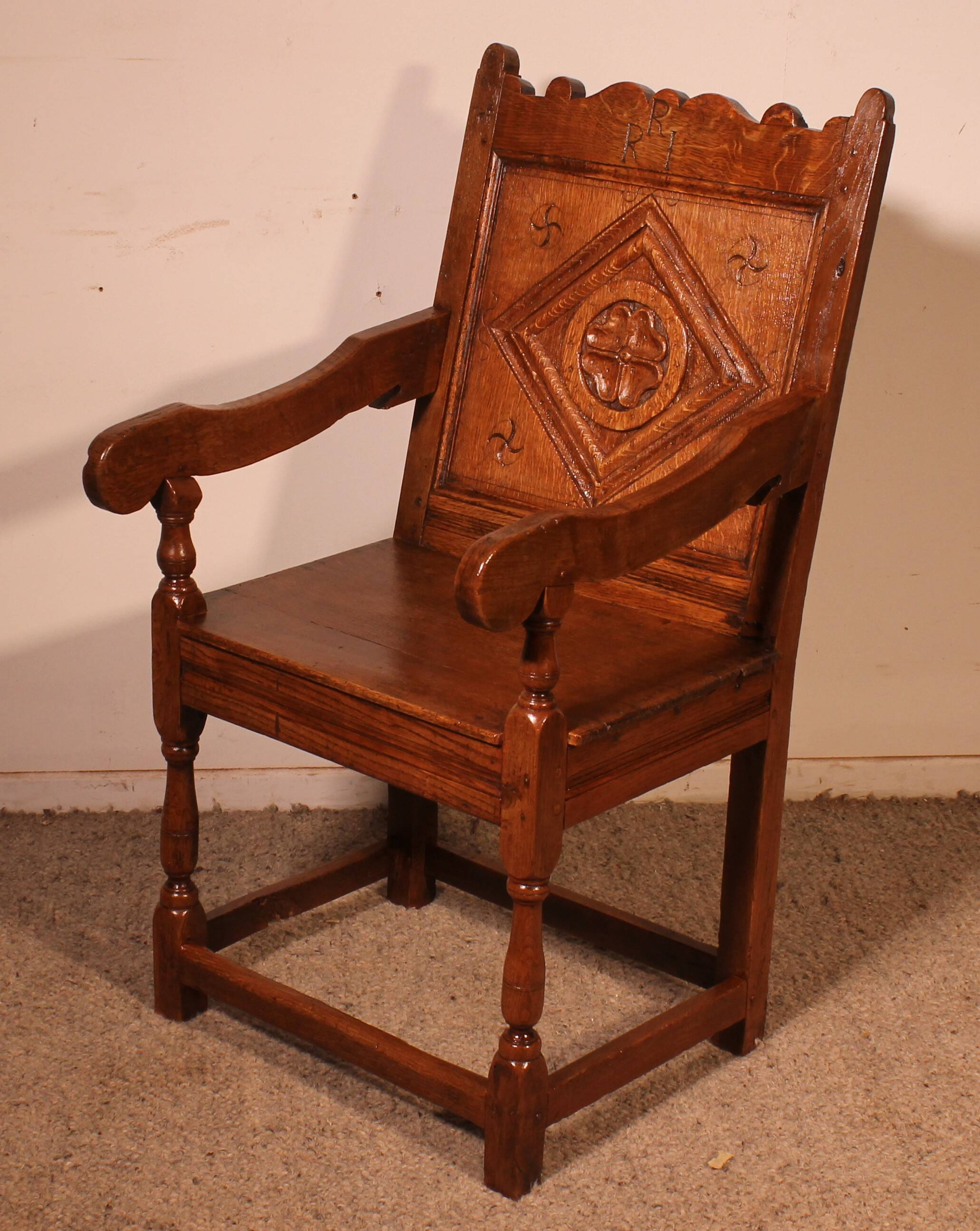 high-backed armchair from the 17th century in oak
