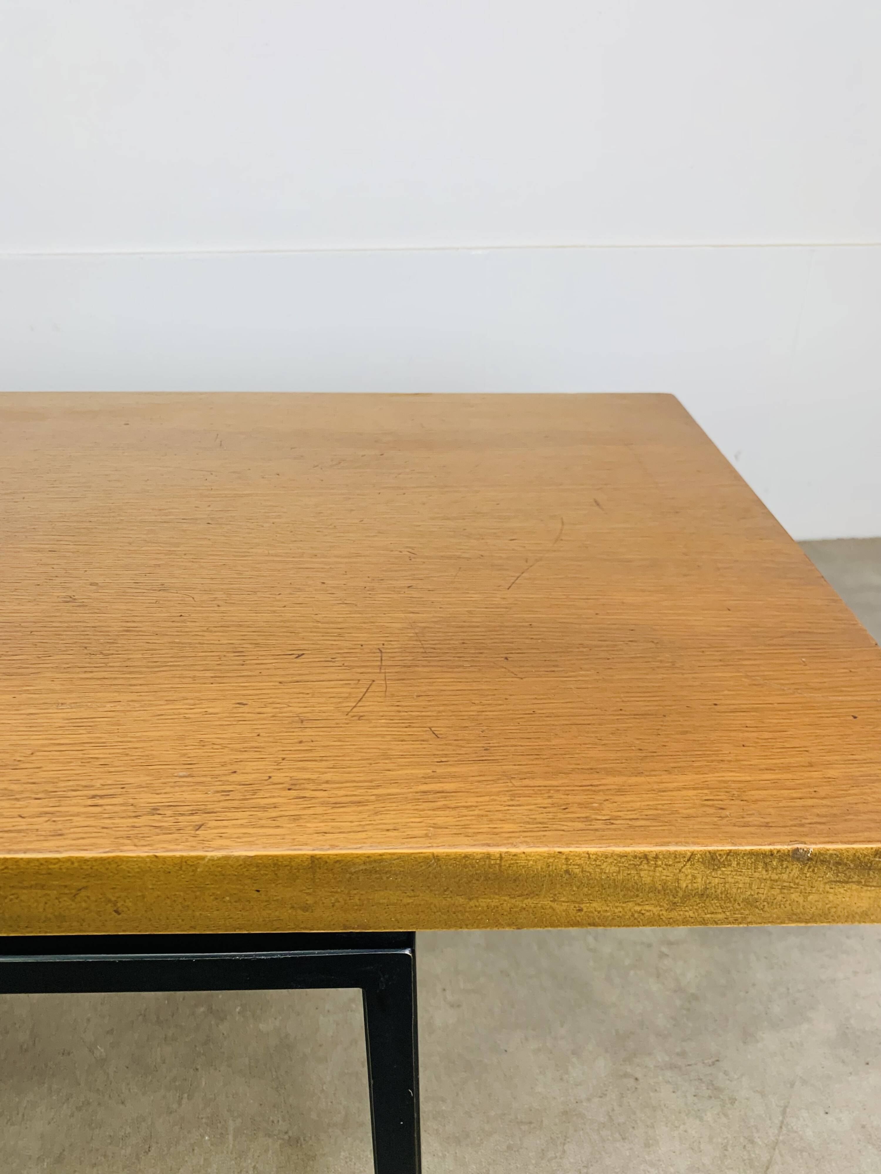 1950s modernist coffee table, wood and black metal.
