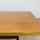 1950s modernist coffee table, wood and black metal.