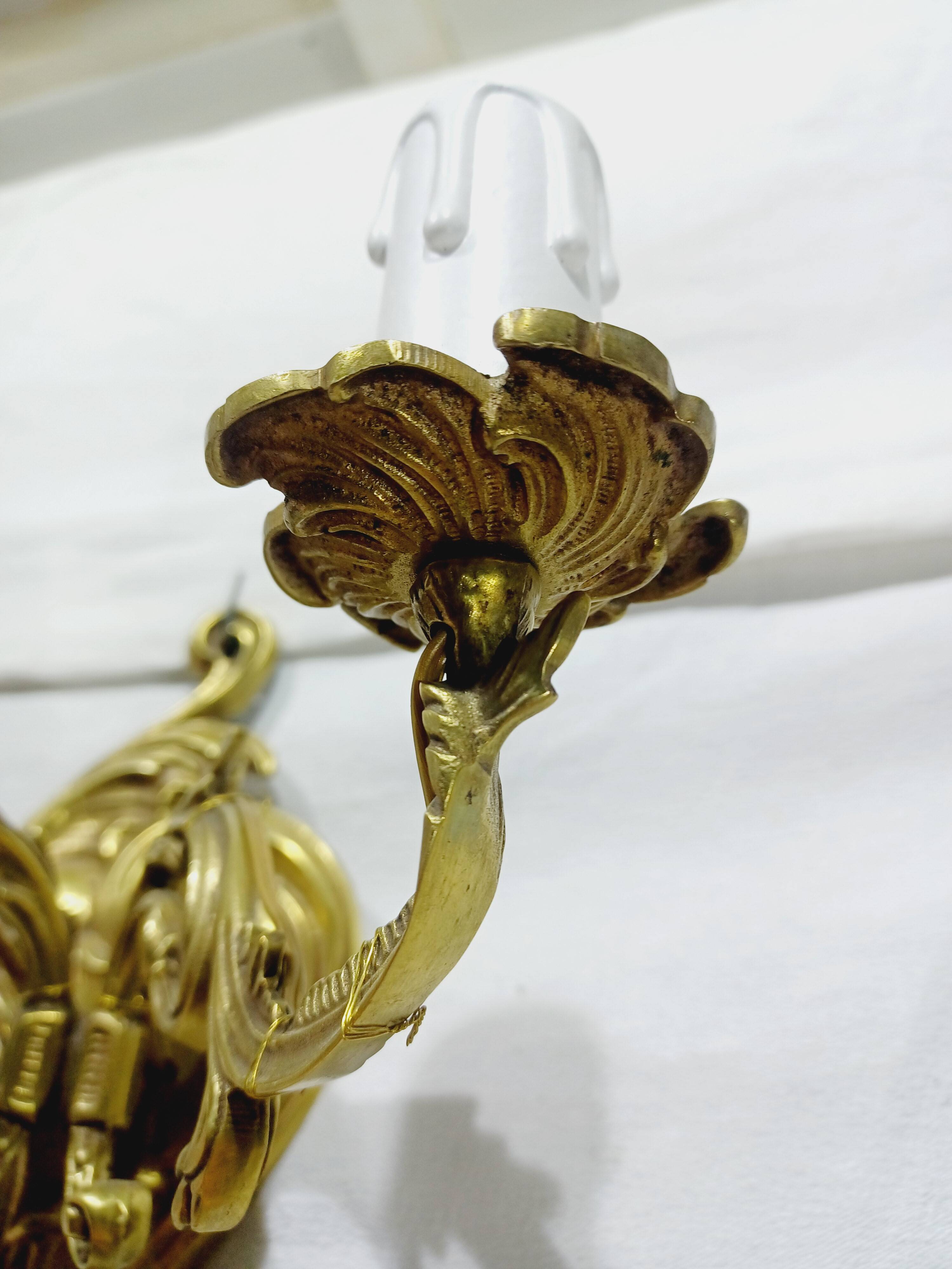 Pair of 2-light bronze wall lights, St. Louis XV