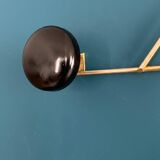 Golden brass coat rack with 3 black vintage hooks from the Mid Century 1950-60.