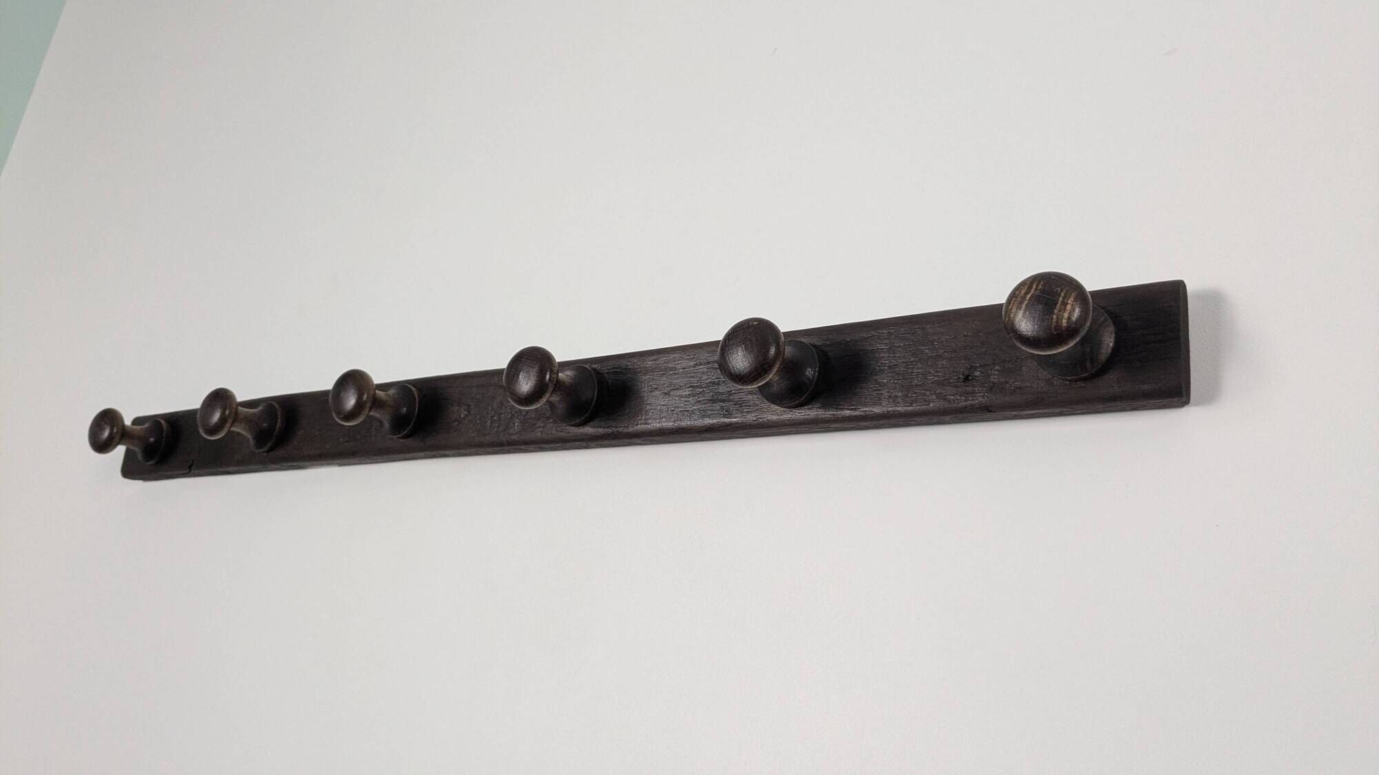 Antique turned wooden coat rack with 6 hooks, rustic spirit.