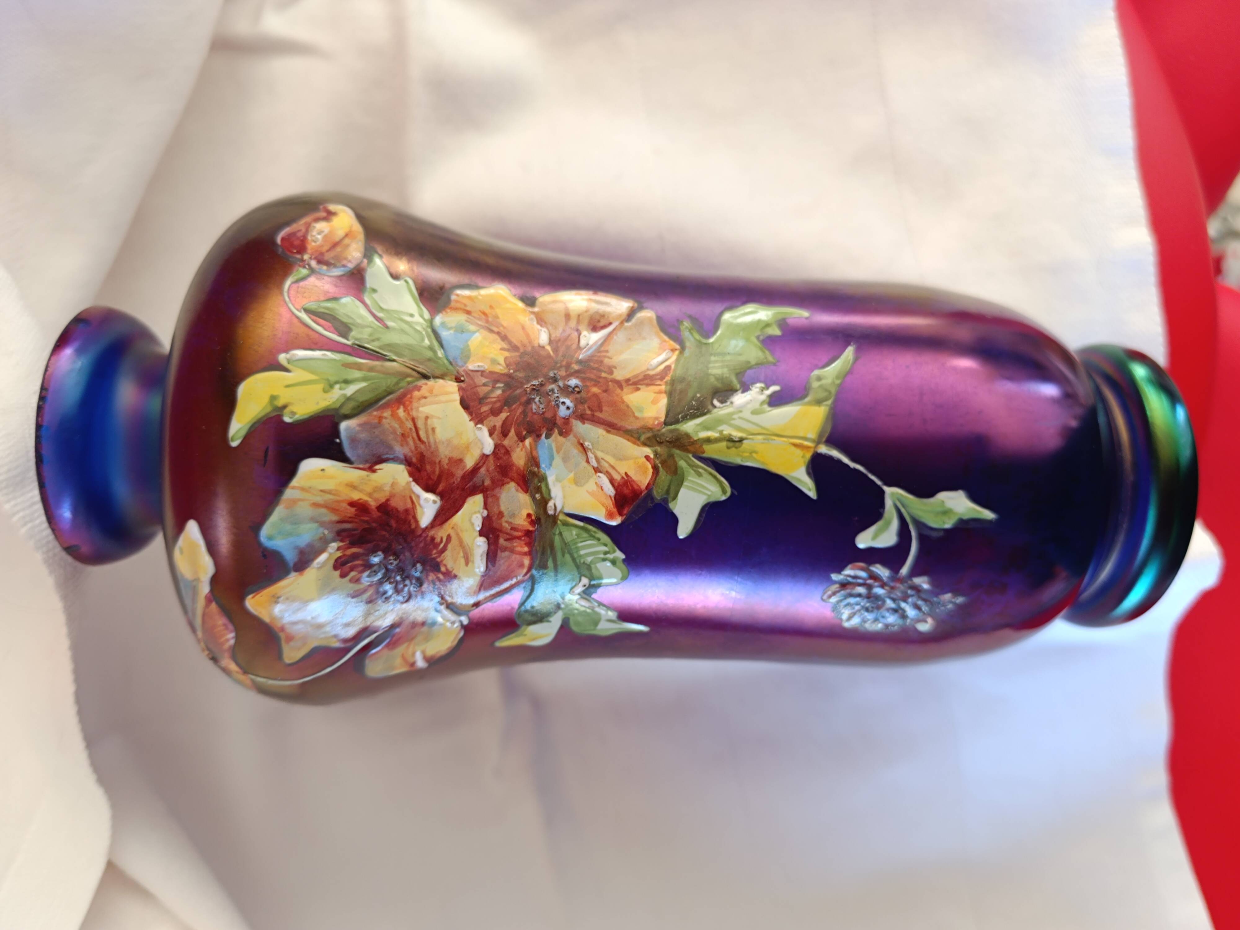 Iridescent glass vase with enamelled flowers, early 20th century