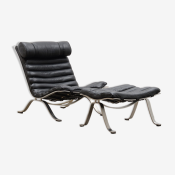 Black “Ari” chair and ottoman by Arne Norell for Norell möbel AB.