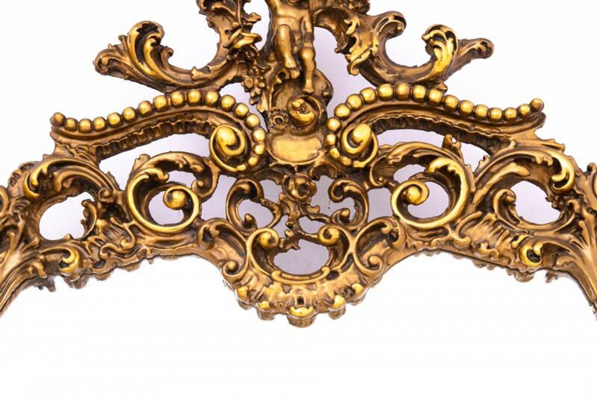 A large mirror in a gold frame, Italy, first half of the 20th century.