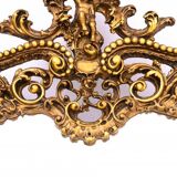 A large mirror in a gold frame, Italy, first half of the 20th century.