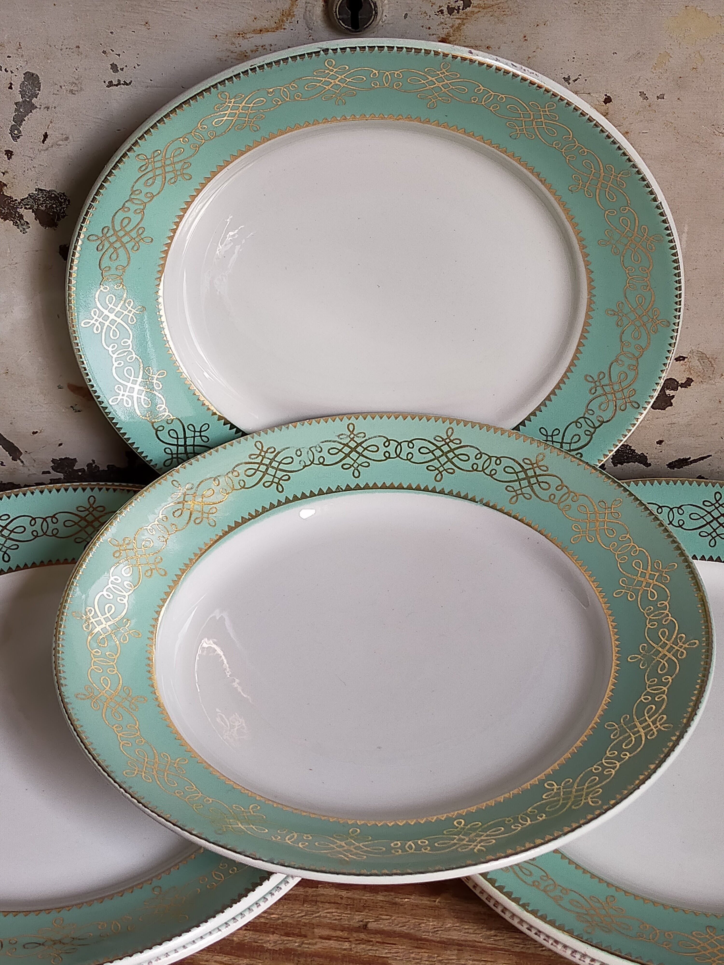 Six plates of vintage Badonviller earthenware with gold frieze