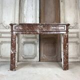 Red marble fireplace in the Louis XVI style, late 19th century