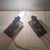 A set of Vitrika Denmark, cast iron wall lights with red details.