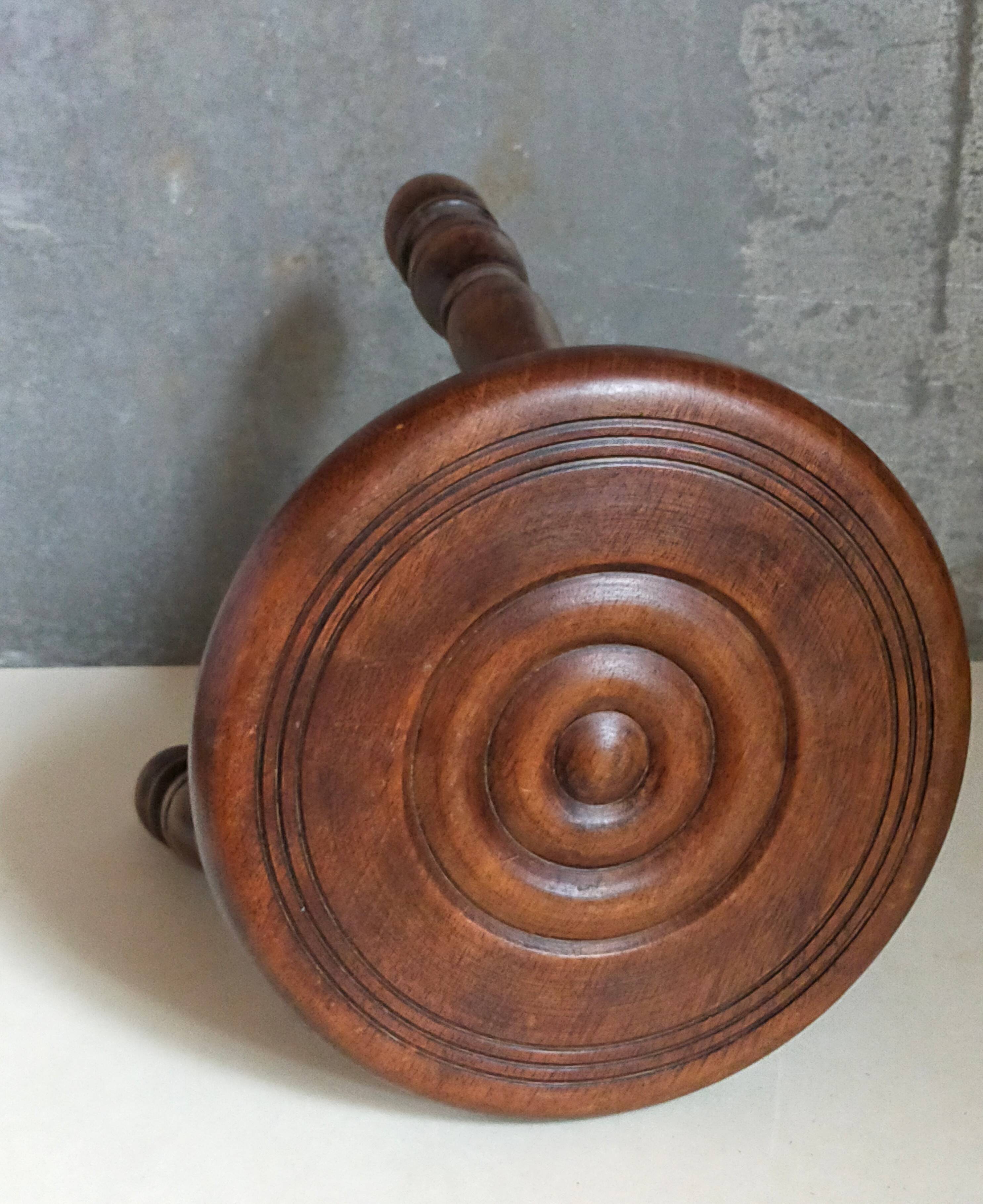 Low tripod stool in vintage turned solid wood